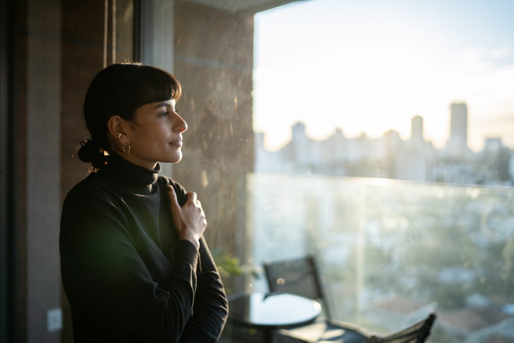 young woman feeling calm and less anxious after using NAC